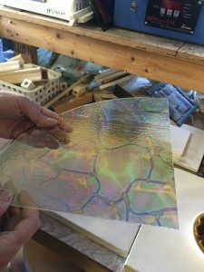A quarter sheet of dichroic glass